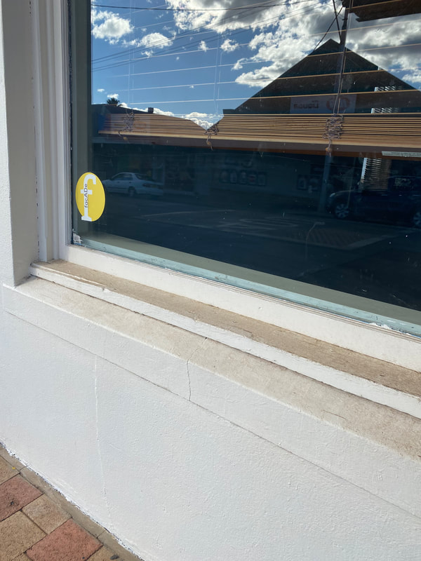 photo of sticker on vacant shop window